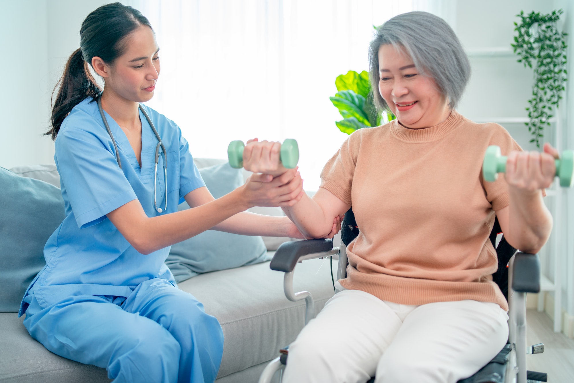 asian-nurse-or-doctor-who-work-as-homecare-support-staff-help-senior-woman-exercise.jpg